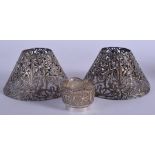 A PAIR OF 19TH CENTURY CONTINENTAL SILVER SHADES together with a silver basket. 4.7 oz. (3)