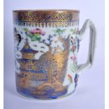 AN 18TH CENTURY CHINESE EXPORT BLUE AND WHITE MUG Qianlong, painted with landscapes. 11 cm high.