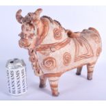 A LARGE EARLY INDUS VALLEY POTTERY FIGURE OF A STANDING COW modelled boldly standing decorated with