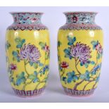 A PAIR OF CHINESE FAMILLE ROSE PORCELAIN VASES 20th Century, painted with flowers. 17.5 cm high.