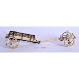 A RARE 19TH CENTURY CONTINENTAL CARVED IVORY CARRIAGE with open work silver banding. 15 cm x 7 cm.