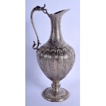 A MIDDLE EASTERN INDO PERSIAN SILVER EWER decorated with flowers and scrolling motifs. 17.7 oz. 28 c