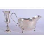 A 1930S SILVER SAUCEBOAT and a silver cup. 6.2 oz. (2)