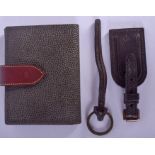 A MULBERRY LEATHER PURSE together with two luggage rings. (3)