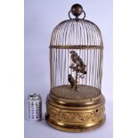 A LARGE ANTIQUE BRASS BOUND TWIN BIRD AUTOMATON SINGING BIRD CAGE decorated with acanthus scrolls. 5