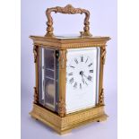 AN ANTIQUE REPEATING BRASS CARRIAGE CLOCK Z Barraclough & Sons of Leeds. 18 cm high inc handle.
