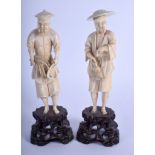 A PAIR OF EARLY 20TH CENTURY CHINESE CARVED IVORY FISHERMAN modelled upon wood bases. Ivory 13.5 cm