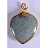 A 19TH CENTURY 22CT GOLD MOUNTED MIDDLE EASTERN CHINESE JADEITE PENDANT. 3 cm x 3.5 cm.