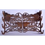 A RARE PAIR OF 19TH CENTURY BAVARIAN BLACK FOREST HANGING GAME RACKS finely carved with animals. Ove