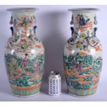 A LARGE PAIR OF CHINESE FAMILLE ROSE PORCELAIN VASES 20th Century. 44 cm high.