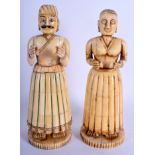 A RARE PAIR OF 19TH CENTURY INDIAN CARVED IVORY AND BONE FIGURES modelled upon circular bases. 22 cm