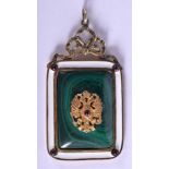 AN UNUSUAL CONTINENTAL SILVER GILT ENAMEL MALACHITE PENDANT. 3.5 cm x 4.75 cm.