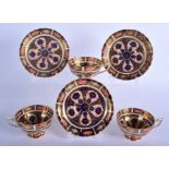 Royal Crown Derby set of three in and out pattern 1128 pedestal cup and saucers. Saucer 14 cm wide.
