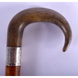 A 19TH CENTURY CONTINENTAL CARVED RHINOCEROS HORN HANDLED WALKING CANE. 88 cm long.