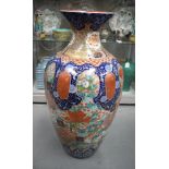 A VERY LARGE 19TH CENTURY JAPANESE MEIJI PERIOD IMARI VASE of huge proportions, enamelled with flowe