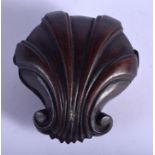 AN EARLY 19TH CENTURY CARVED WOOD TREEN SNUFF MOURNING BOX in the form of a scrolling shell. 7.5 cm
