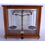 A CASED PAIR OF VINTAGE MICROID SCALES. 42 cm x 38 cm.