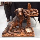 A MAGNIFICANT RARE 19TH CENTURY BAVARIAN BLACK FOREST CARVED STICK STAND modelled as a seated hound