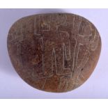 AN UNUSUAL EARLY CONTINENTAL CARVED PEBBLE possibly South American, decorated with primitive figures