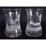 A PAIR OF EARLY 20TH CENTURY BOHEMIAN ENGRAVED CRYSTAL MUGS decorated with a cock and stag. 14.5 cm
