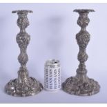 A RARE PAIR OF EARLY 20TH CENTURY TIFFANY & CO SILVER CANDLESTICKS decorated with flowers. 110 oz (w