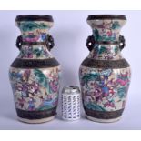 A LARGE PAIR OF 19TH CENTURY CHINESE CANTON FAMILLE ROSE VASES Qing, painted with warriors within la