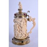 A MID 19TH CENTURY SILVER GILT JEWELLED DIEPPE IVORY TANKARD decorated with figures in various pursu