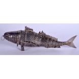 A 19TH CENTURY CONTINENTAL SILVER ARTICULATED FISH of naturalistic form, with hinged head. 6.7 oz. 2