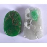 AN EARLY 20TH CENTURY CHINESE CARVED JADEITE AMULET together with another. Largest 3.5 cm x 5.5 cm.