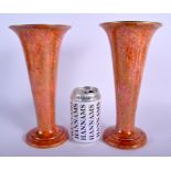 A STYLISH PAIR OF WEDGWOOD LUSTRE ORANGE PORCELAIN VASES with internal foliate border. 25 cm high.