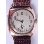 A VINTAGE 9CT GOLD CUSHION SHAPED WRISTWATCH. 2.75 cm wide.