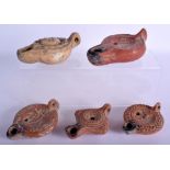 A GROUP OF FIVE 19TH CENTURY GRAND TOUR POTTERY OIL LAMPS After the Antiquity. Largest 18 cm long. (