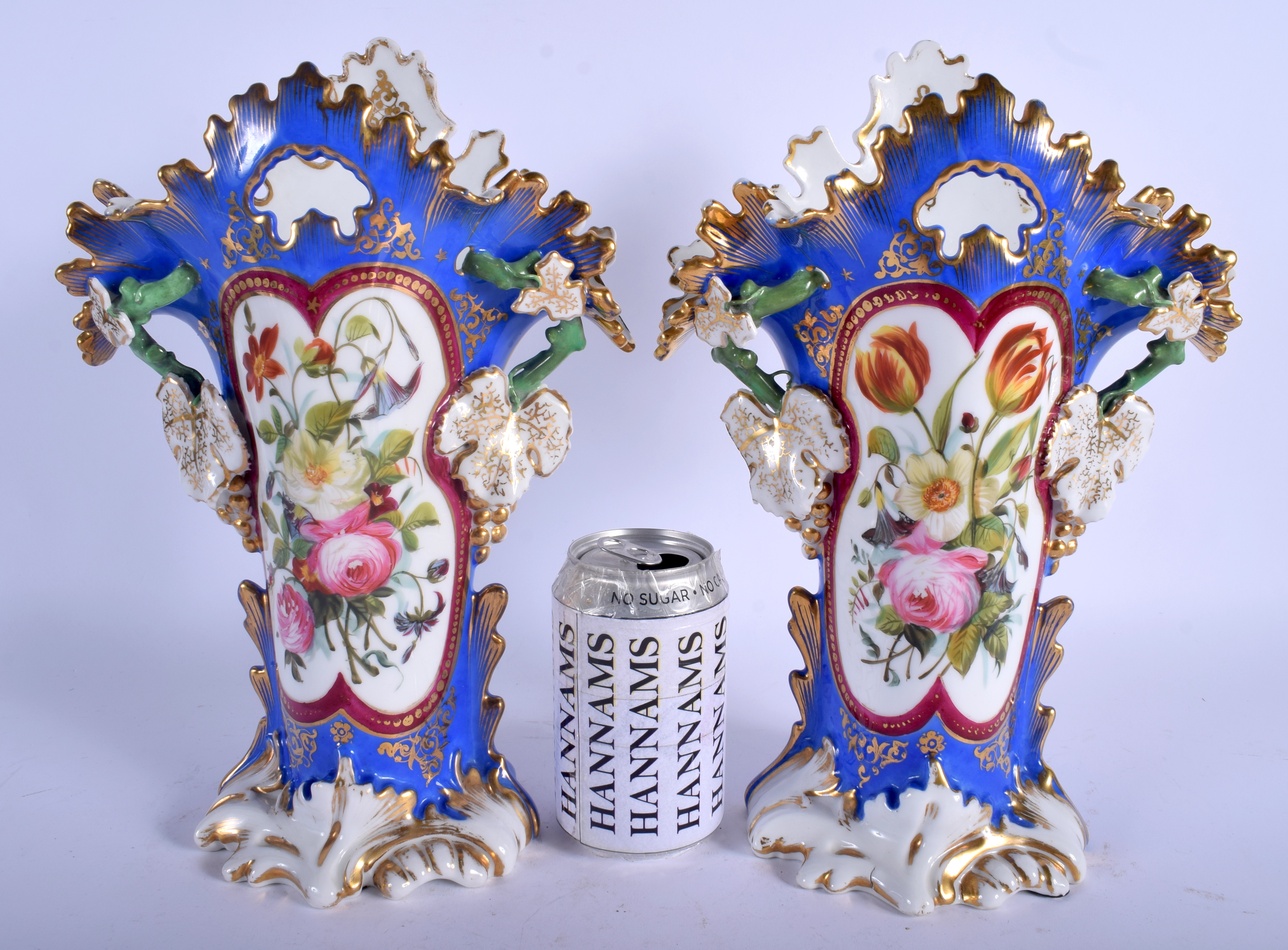 A LARGE PAIR OF 19TH CENTURY FRENCH PARIS PORCELAIN VASES painted with flowers. 34 cm x 16 cm.