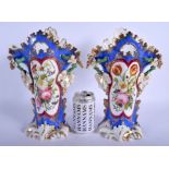 A LARGE PAIR OF 19TH CENTURY FRENCH PARIS PORCELAIN VASES painted with flowers. 34 cm x 16 cm.