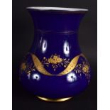 A VINTAGE BOHEMIAN BLUE AND GILT GLASS VASE with opaque enamelled interior. 18 cm high.