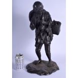 A LARGE 19TH CENTURY JAPANESE MEIJI PERIOD BRONZE OKIMONO modelled as a male holding a pipe. 49 cm x