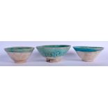 A SET OF THREE 12TH CENTURY PERSIAN IRANIAN GLAZED BOWLS 12th Century. Largest 13.5 cm wide. (3)