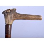 A RARE 19TH CENTURY CARVED ANTLER HORN WALKING CANE mounted with copper and wood rom HMS Foudroyant.