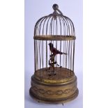 AN EARLY 20TH CENTURY CONTINENTAL BRASS AUTOMATON SINGING BIRD CAGE decorated with neo classical mot