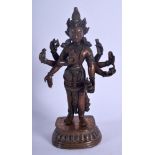 A CHINESE QING DYNASTY COPPER ALLOY BRONZE MULTI ARM DEITY upon a shaped base. 20 cm high.