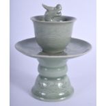 A CHINESE GREEN CELADON GLAZED TEABOWL ON STAND 20th Century. 17 cm x 10 cm.