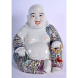 A CHINESE FAMILLE ROSE PORCELAIN BUDDHA 20th Century, decorated with foliage. 28 cm x 17 cm.