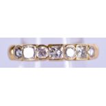 A VINTAGE GOLD AND SEVEN STONE DIAMOND RING of approx 0.5 cts. 4 grams. M/N.