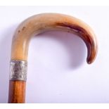 A 19TH CENTURY CONTINENTAL CARVED BUFFALO HORN HANDLED WALKING CANE. 88 cm long.