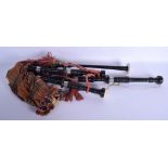 A SET OF VINTAGE SCOTTISH BAGPIPES with tartan mounts. 75 cm long.