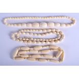 THREE EARLY 20TH CENTURY CONTINENTAL CARVED IVORY NECKLACES. Largest 62 cm long. (3)