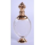 AN ANTIQUE GOLD MOUNTED FRENCH SCENT BOTTLE. 10 cm high.