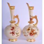 Royal Worcester two shape 783 blush ivory ewers date code 1893 to both. 19 cm high