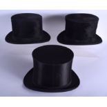 TWO VINTAGE TOP HATS and a folding top hat. (3)