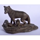 A CONTINENTAL BRONZE FIGURE OF A WOLF modelled with two young upon a shaped base. 13 cm x 9 cm.